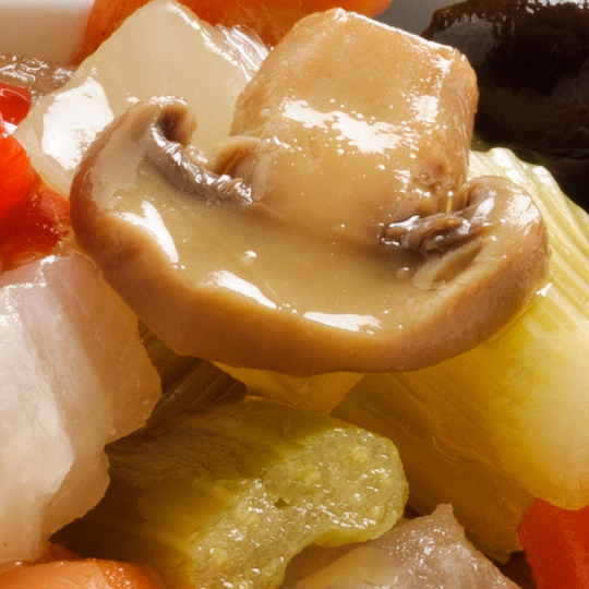 Mixed vegetables with mushrooms in oil